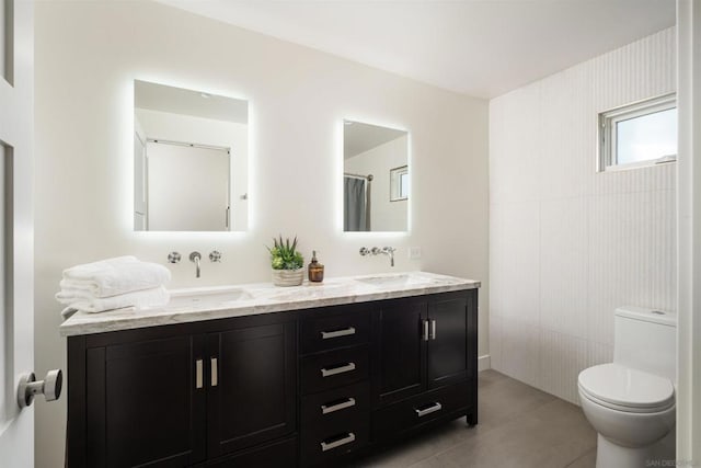 bathroom featuring vanity and toilet