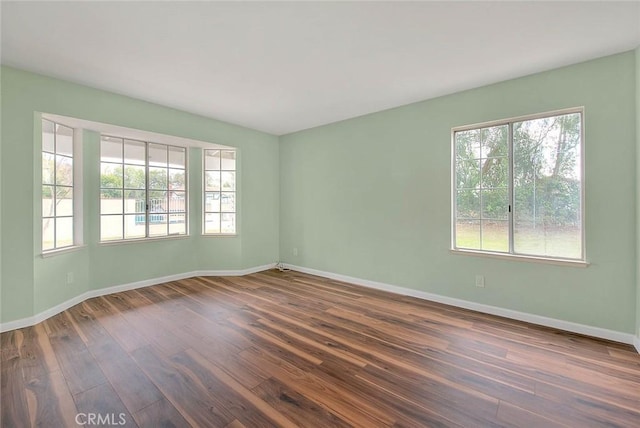 empty room featuring dark hardwood / wood-style floors