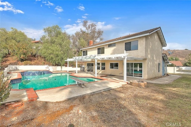 rear view of house with a patio and a pergola