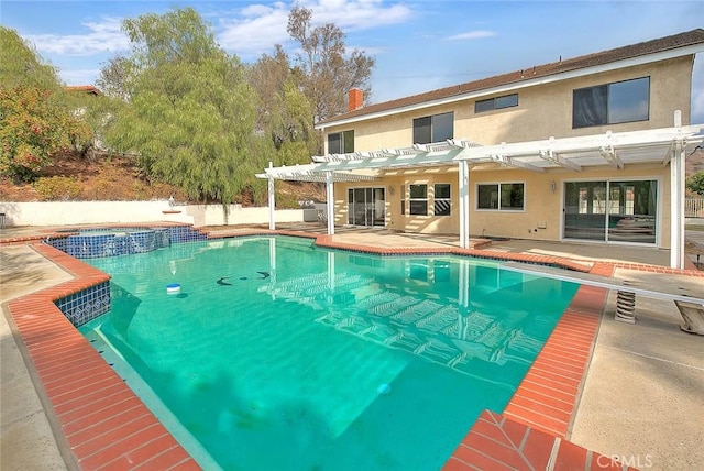 view of swimming pool with a pergola, a patio area, and a diving board