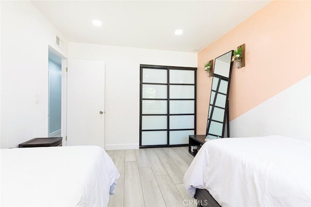 bedroom featuring light hardwood / wood-style flooring