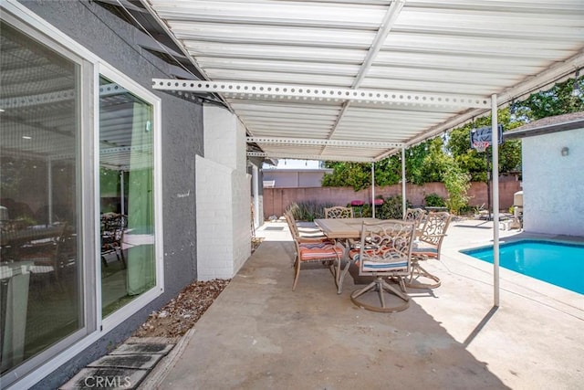 view of patio featuring a fenced in pool