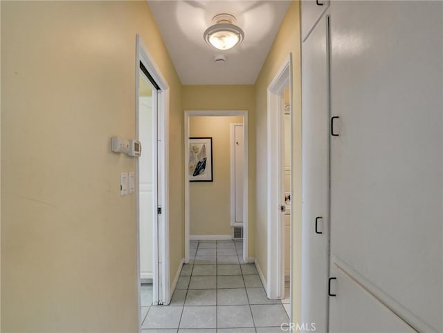 hallway with light tile patterned floors