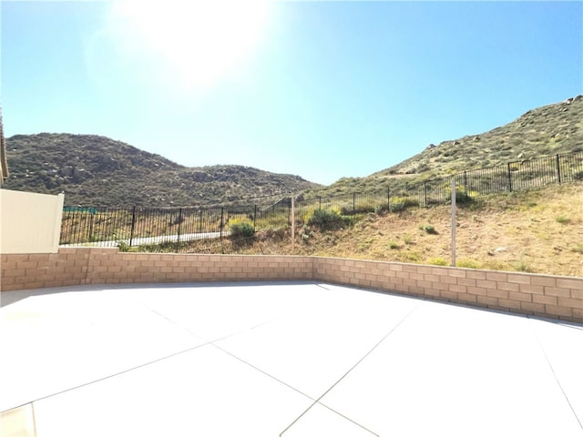 5393 Viewstone Ct, Hemet, CA 92545 - view of patio with a mountain view and a fenced backyard