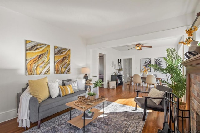 living room with hardwood / wood-style flooring and ceiling fan