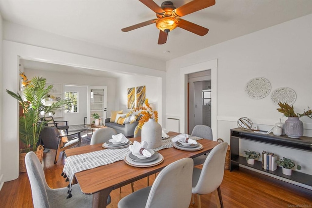 dining area featuring dark hardwood / wood-style flooring and ceiling fan