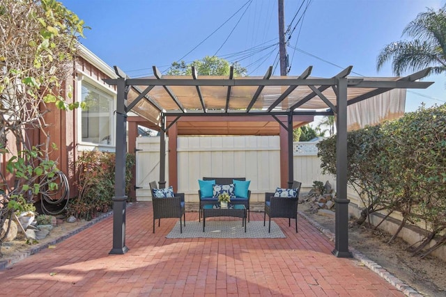 view of patio with an outdoor living space and a pergola