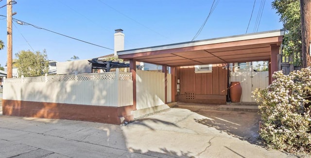 view of property exterior with a carport