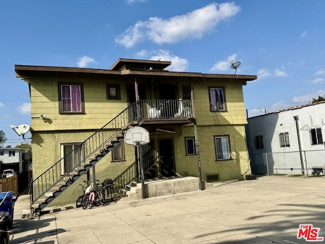 back of property with a patio