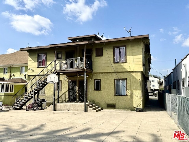 back of property featuring a patio area