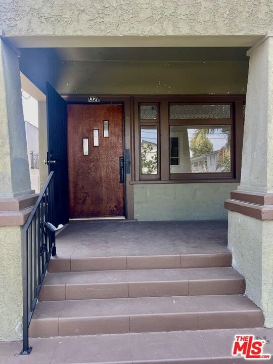 doorway to property featuring a porch