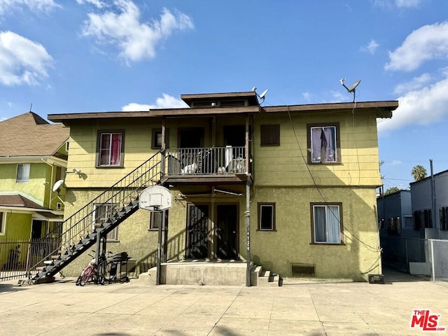 rear view of property with a patio area