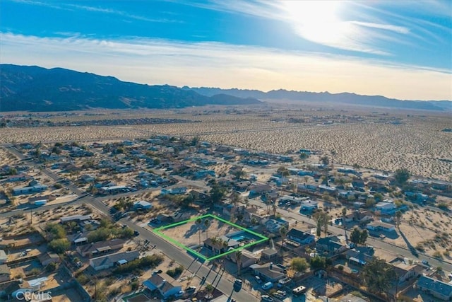 birds eye view of property with a mountain view