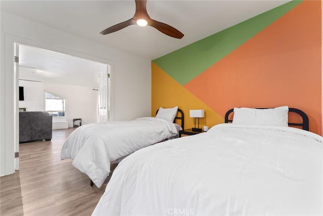 bedroom featuring light hardwood / wood-style flooring and ceiling fan