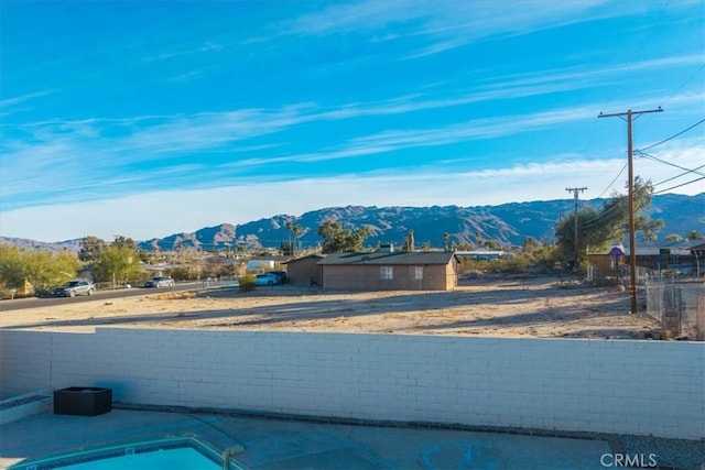 view of swimming pool featuring a mountain view