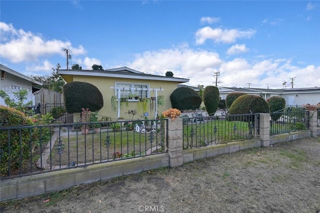 bungalow-style house with a front yard