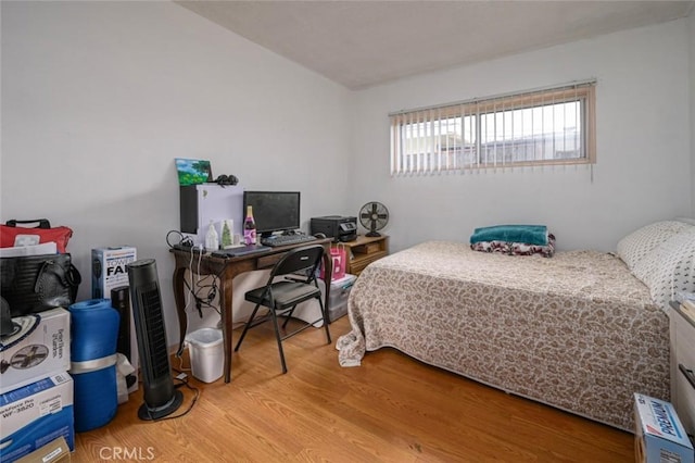 bedroom with wood-type flooring