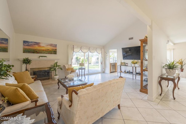 tiled living room featuring high vaulted ceiling