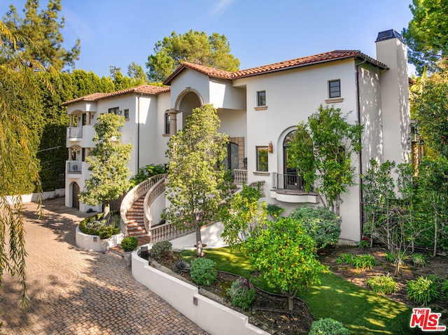 mediterranean / spanish-style house featuring a balcony