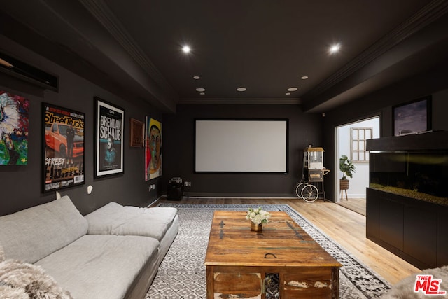 home theater with crown molding and hardwood / wood-style floors