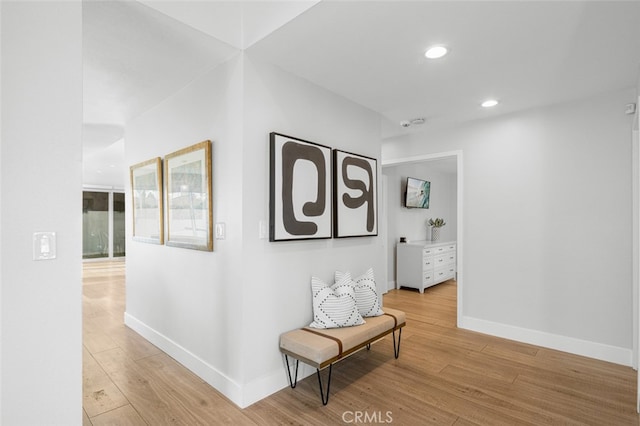 hall with light hardwood / wood-style floors