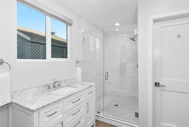 bathroom featuring vanity and walk in shower