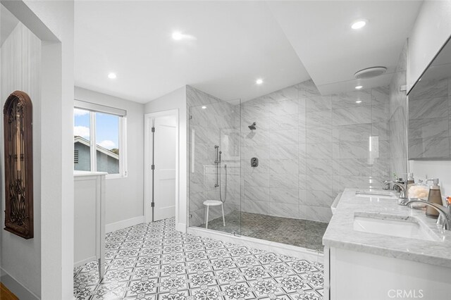 bathroom featuring vanity and a tile shower