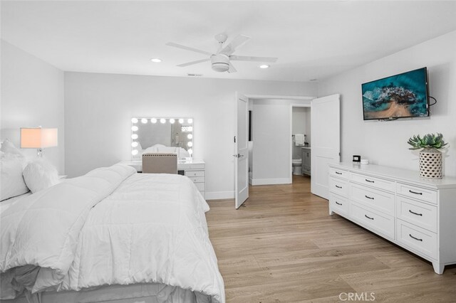 bedroom with ceiling fan and light hardwood / wood-style floors