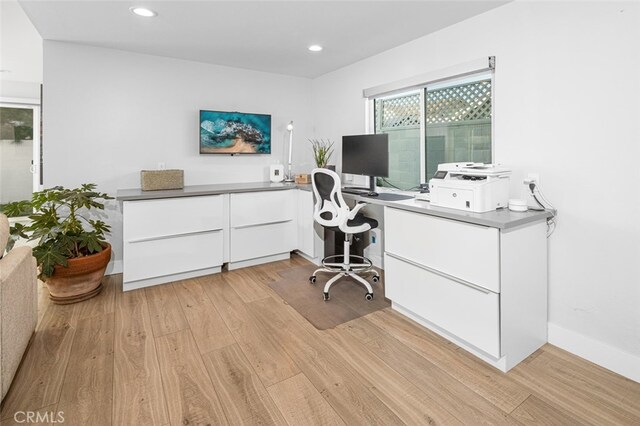 home office with light wood-type flooring