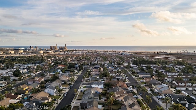 aerial view at dusk with a water view