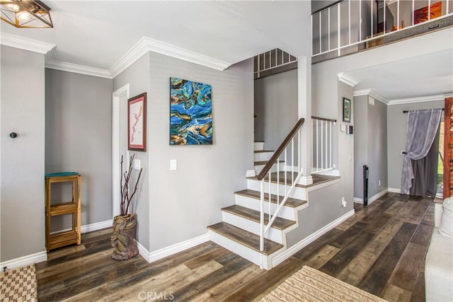 staircase featuring wood-type flooring and ornamental molding