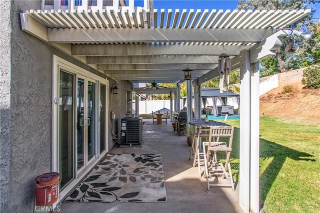 view of patio / terrace featuring central AC, ceiling fan, exterior bar, and a pergola