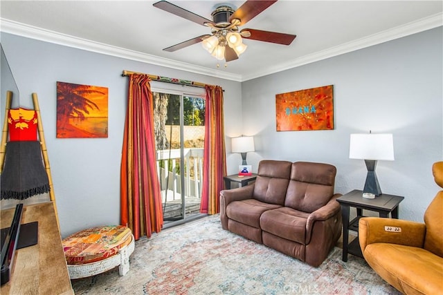 living room featuring ornamental molding and ceiling fan