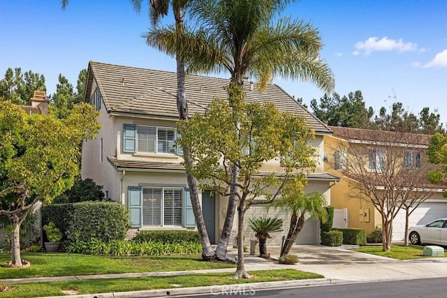 view of front of home with a garage and a front yard