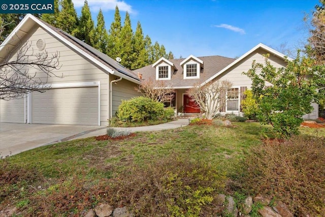 view of front facade with a garage and a front yard