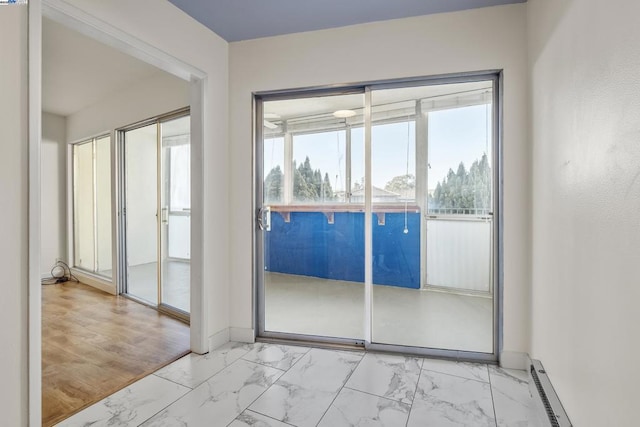 doorway with a baseboard heating unit