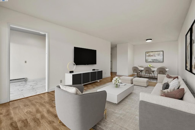 living room with a baseboard radiator and light hardwood / wood-style floors