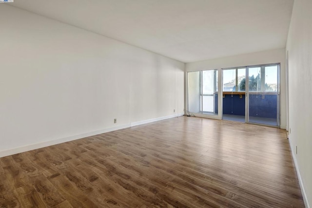 unfurnished room featuring hardwood / wood-style floors