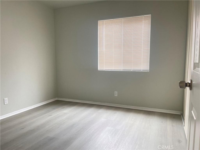 unfurnished room featuring light hardwood / wood-style flooring