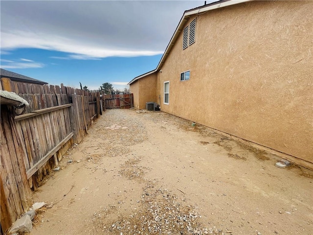 view of side of home featuring cooling unit