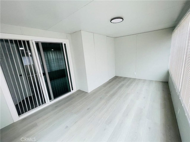 spare room with light hardwood / wood-style flooring