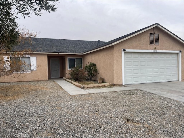 ranch-style home with a garage