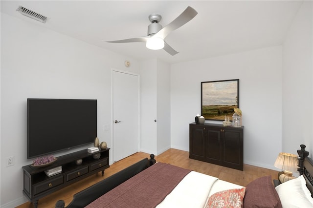 bedroom with ceiling fan and light wood-type flooring