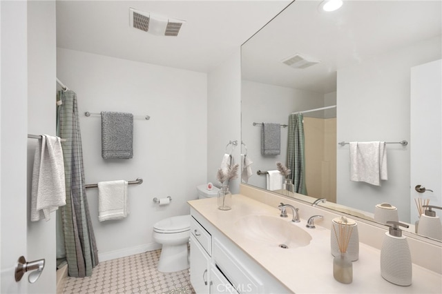 bathroom featuring vanity, toilet, and a shower with shower curtain