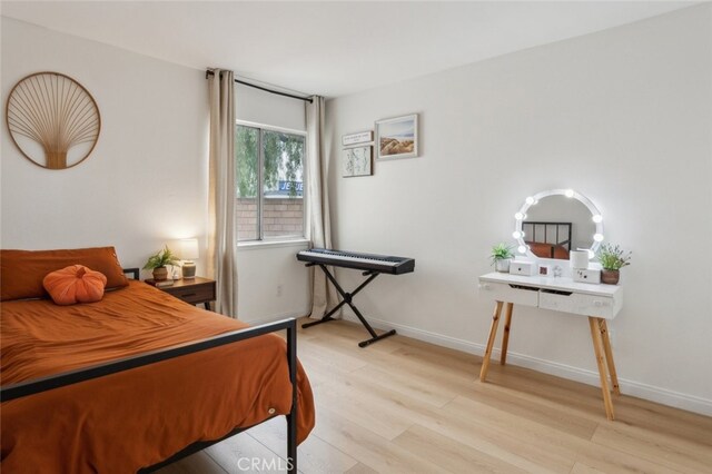 bedroom with light hardwood / wood-style floors