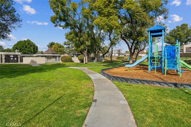 view of jungle gym featuring a lawn