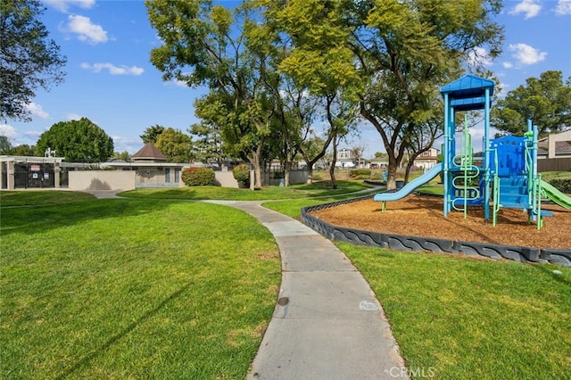 community playground featuring a lawn