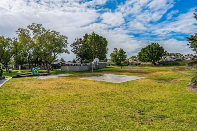 view of yard featuring community basketball court