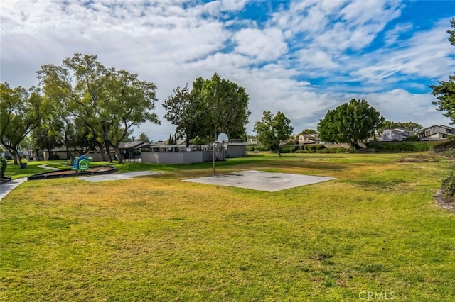 view of yard featuring community basketball court