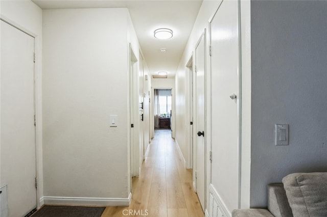 2979 Cardamon St, Rialto, CA 92376 - corridor featuring light wood finished floors and baseboards